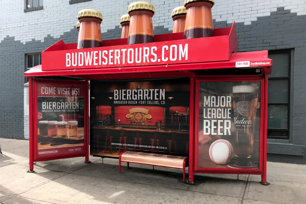 Bus Stop Advertisement for Anheuser-Busch is Showcasing an Enhanced Curbside Castle with Beers Model on its Top