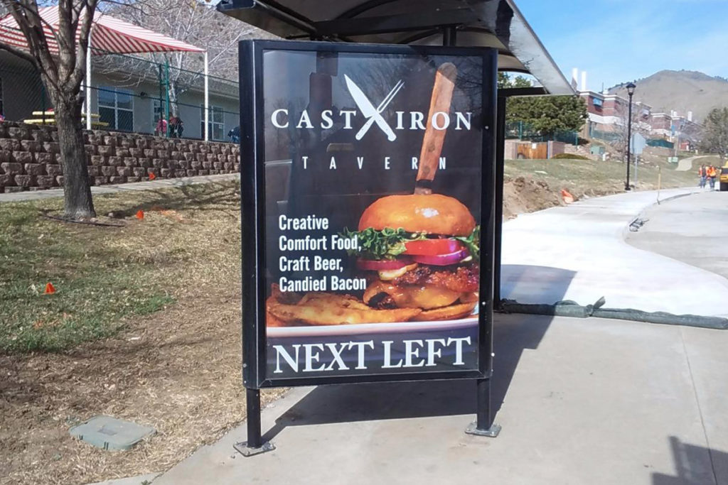 Bus Stop Poster Pointing a Next Left to Cast Iron Tavern
