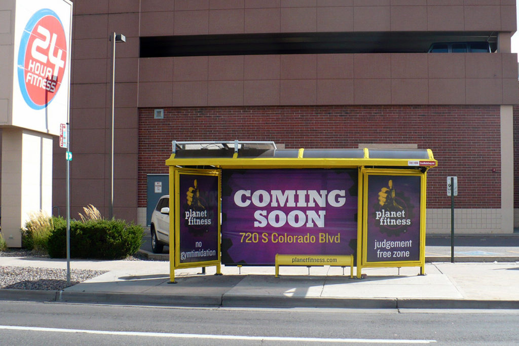 Bus Stop Advertisement Showcasing an Enhanced Curbside Castle for Planet Fitness