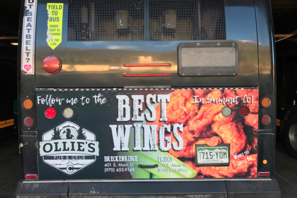 Mountain Tail bus advertisement for Ollie's Pub and Grub