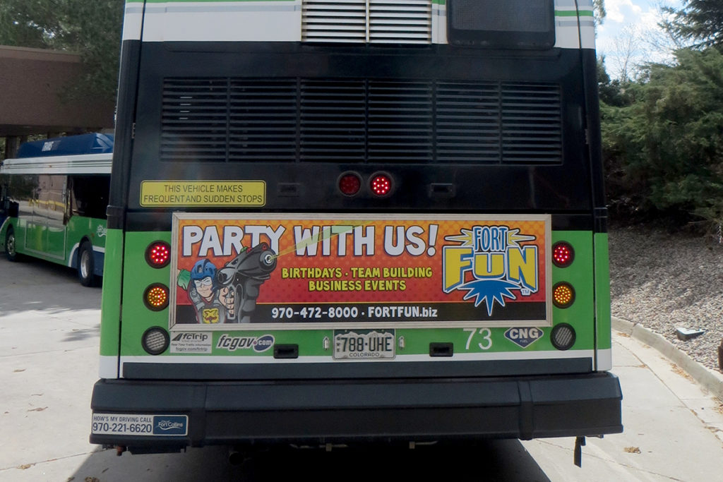 Fort Fun advertisement on bus tail panel